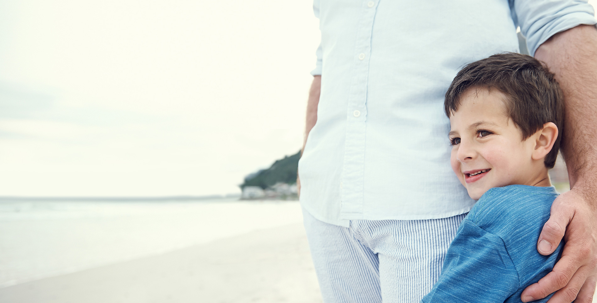 Father and son enjoying the ocean view