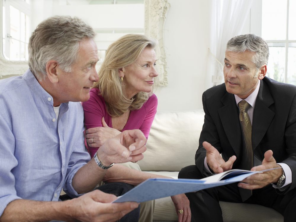Older couple discussing long-term care insurance with an advisor