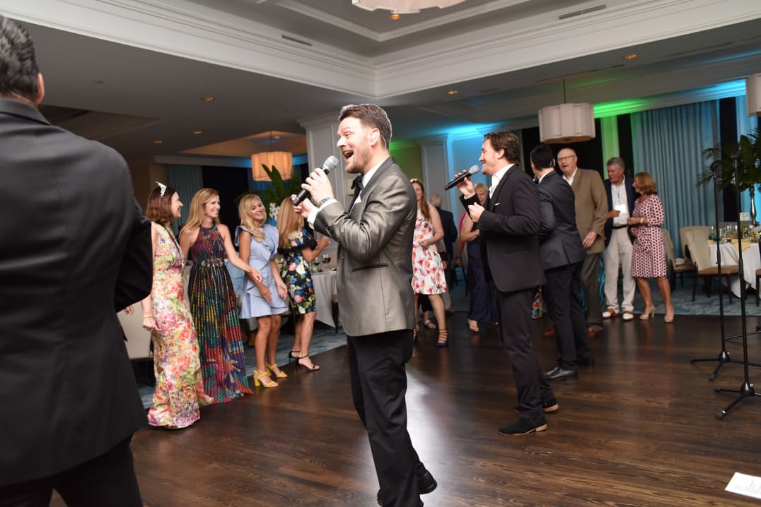 Singers from The Modern Gentleman performing Beatles songs at SanCap Cares gala