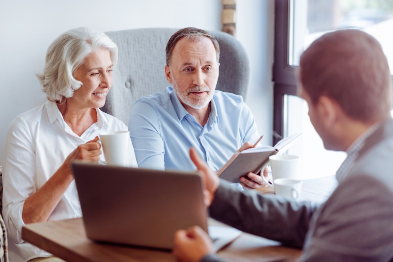 Older couple discussing taxes with an advisor