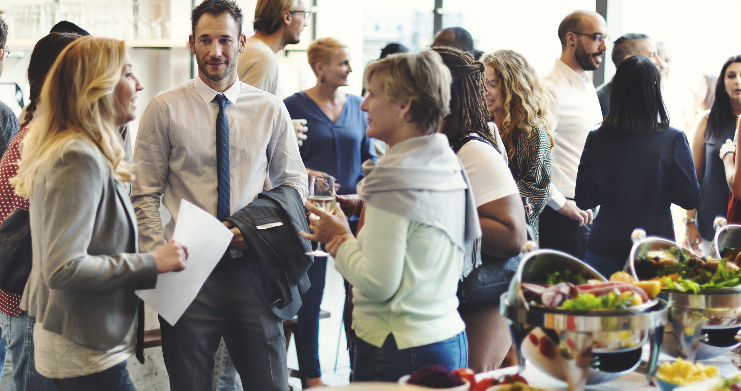 People mingling and networking at corporate event