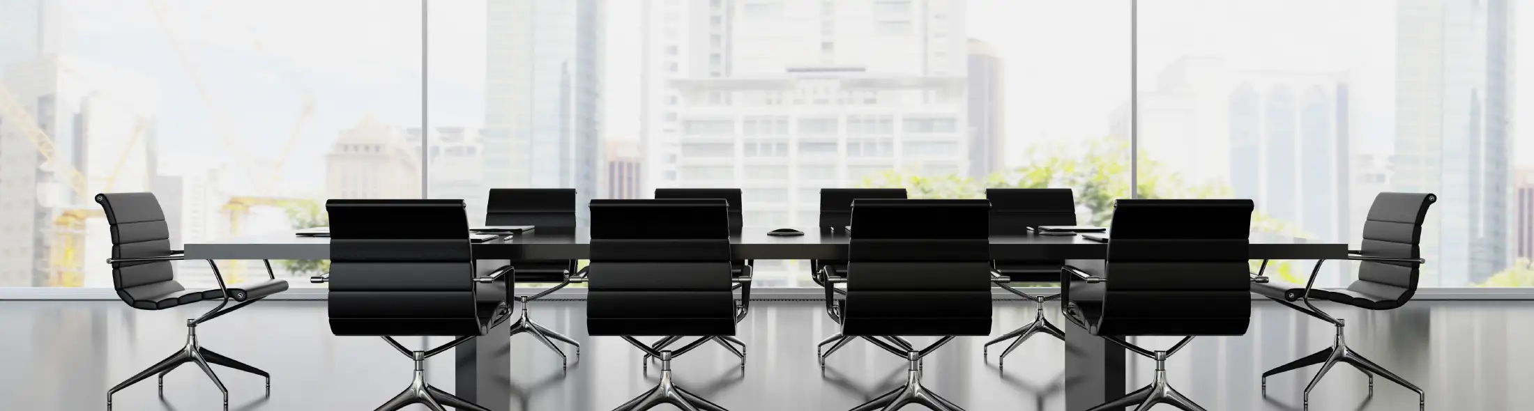 Interior of boardroom with black armchairs